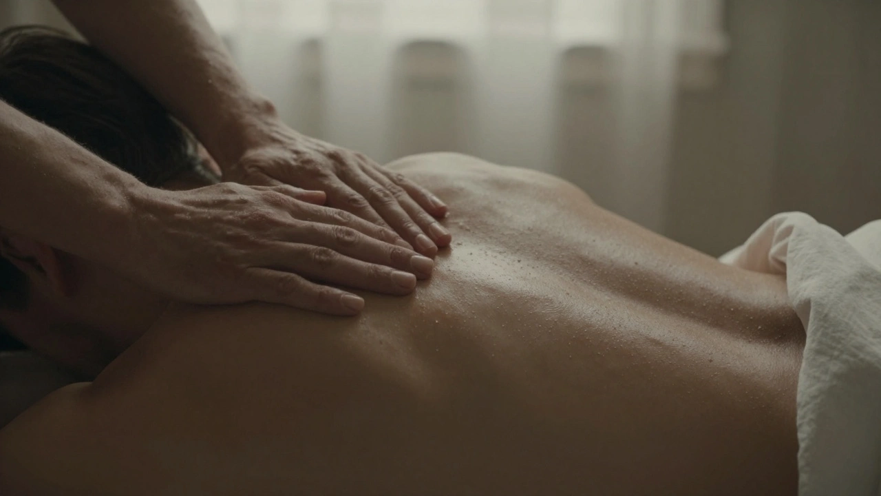Close-up of hands gliding over bare skin during a slow, tender massage, oil shimmering under warm light.